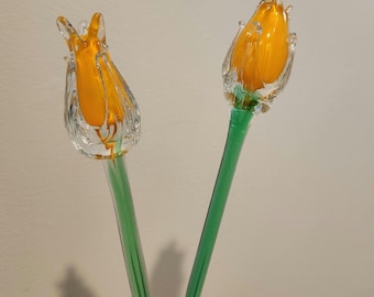 Vtg pair of yellow glass tulip buds; 2 hand blown glass flowers yellow inside and clear glass on the outside with long green glass stems