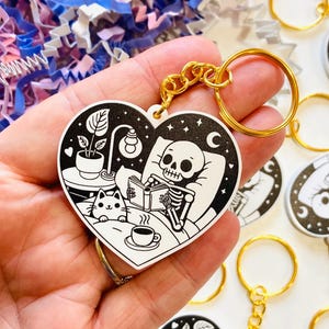 Cute Skeleton Reading a book Keychain, Cute Bookish Keyring, White Acrylic Keyring, reader gift, Bookworm Gifts, Book Club Gift