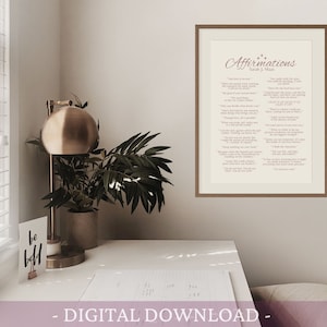K&ouml;nnte beinhalten: Ein gerahmter Druck mit dem Text "Affirmations" in einer kursivschrift. Der Druck ist auf cremefarbenem Hintergrund mit rosa Text. Der Rahmen ist aus braunem Holz.