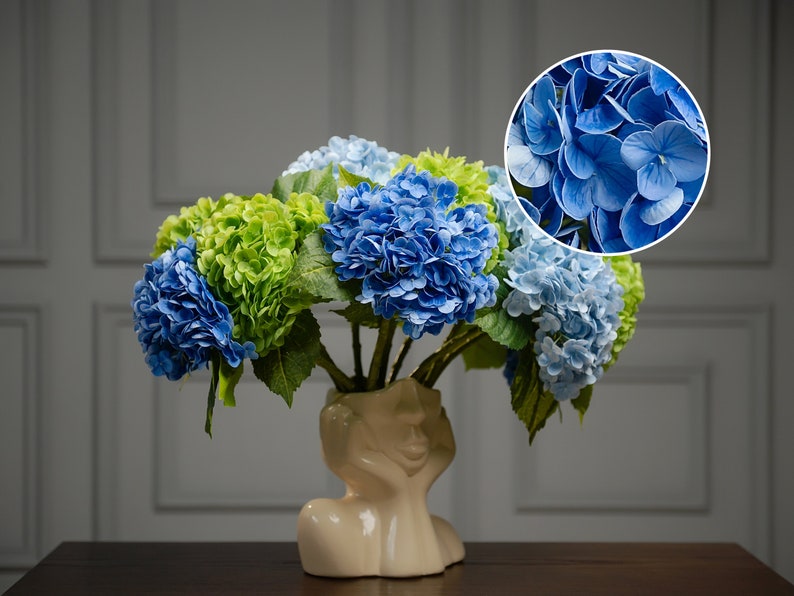 Wedding reception transformed with custom artificial hydrangea centerpieces, bespoke bridal table decor featuring faux flower arrangements.