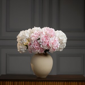 Bridal table centerpiece masterpiece, custom artificial hydrangea arrangement, faux wedding decor for an unforgettable reception.