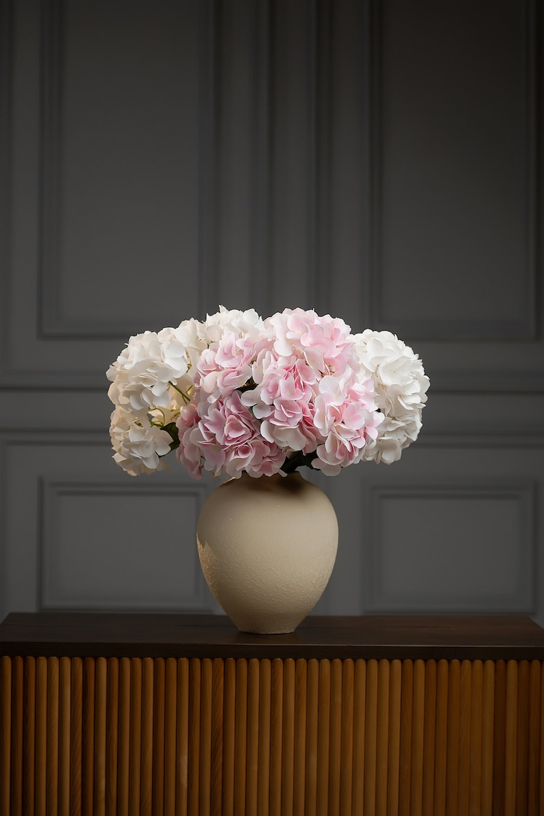 Bridal table centerpiece masterpiece, custom artificial hydrangea arrangement, faux wedding decor for an unforgettable reception.