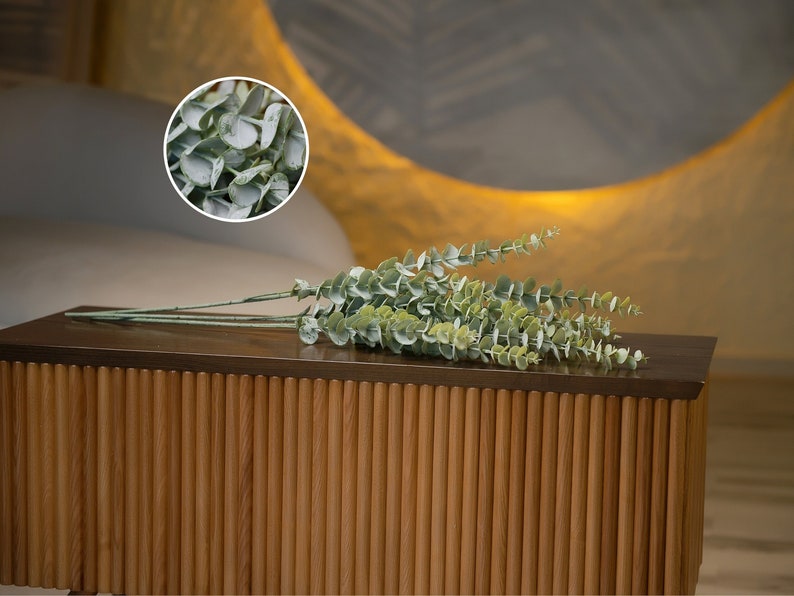 Enhance your decor with the Extra-Long Fake Eucalyptus Branch, a 35" premium artificial greenery perfect for Boho bouquets and wedding decorations.