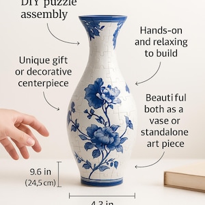 May include: A white and blue floral puzzle vase. The 120-piece DIY puzzle assembles into a vase that is 9.6 inches (24.5 cm) tall and 4.3 inches (11 cm) wide. It is a unique gift or decorative centerpiece, hands-on and relaxing to build.