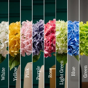 May include: Ten bouquets of artificial hydrangea flowers in various colors, including orange, white, yellow, pink, purple, rose, light green, blue, green, and light blue.