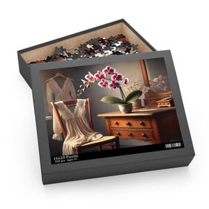 May include: A 500 piece jigsaw puzzle featuring a still life of a white dress draped over a chair, a potted orchid plant, and a wooden dresser with drawers. The puzzle box is gray with the text "16x20 Puzzle 500 pcs Ages 9+"