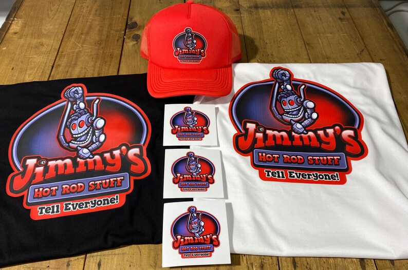 May include: A set of merchandise featuring a robot mascot with the text "Jimmy's Hot Rod Stuff Tell Everyone!"  The set includes a black t-shirt, a white t-shirt, a red trucker hat, and three stickers.