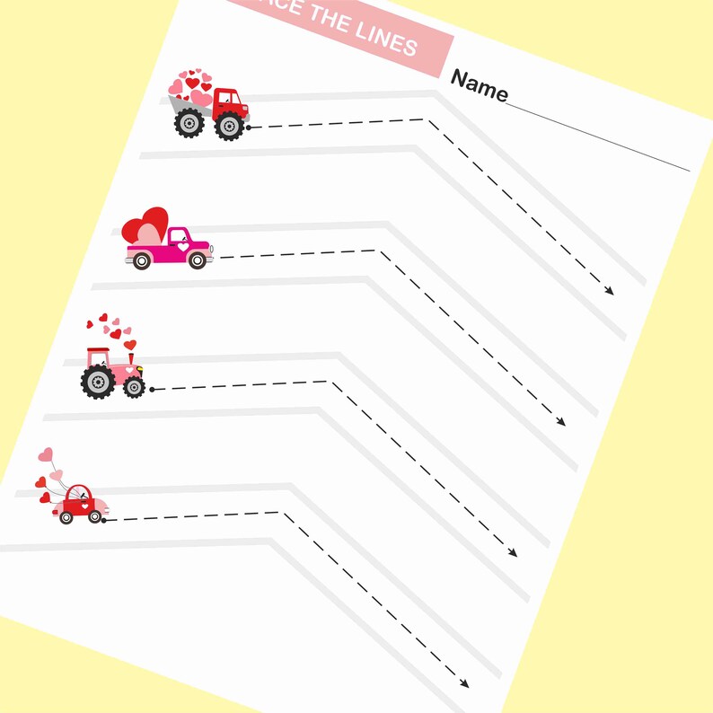 May include: A printable worksheet with the text "Trace the Lines" at the top. There are four images of vehicles carrying hearts. The vehicles are a red truck, a pink pickup truck, a pink tractor, and a red car. Each vehicle has a dashed line that needs to be traced. The worksheet also has a space for a name.