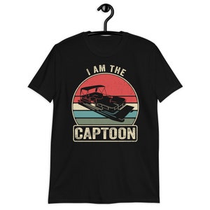 May include: Black t-shirt with a vintage-style graphic of a pontoon boat and the text "I am the Captoon".