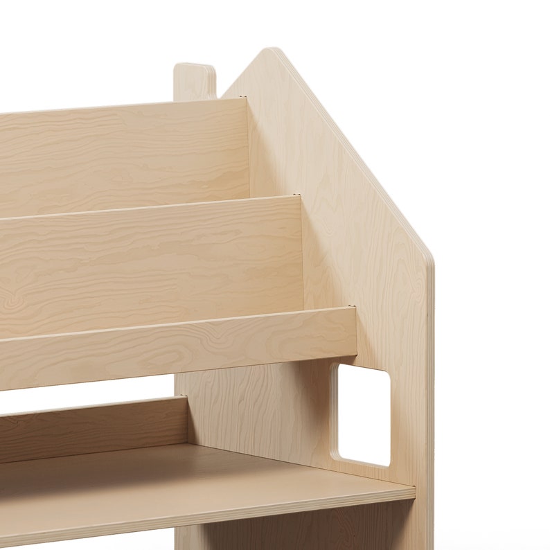 May include: A light wood bookshelf shaped like a house with three shelves and a small window cutout.