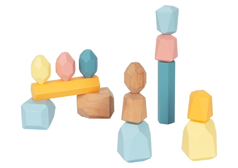 May include: A set of colorful wooden blocks in various shapes, including geometric shapes and rectangular blocks. The blocks are stacked in different configurations, creating a playful and creative scene.