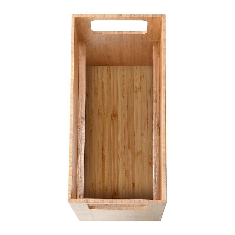 May include: Empty wooden storage box with a handle on the top and two handles on the sides. The box is made of light brown bamboo.