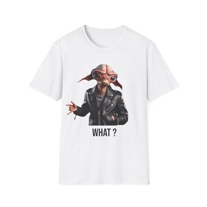 May include: White t-shirt featuring a stylized alien character in a black leather jacket. The alien has large eyes and ears, with the word "WHAT?" printed below the image in black.