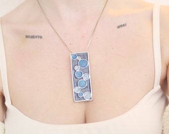 Abstract patterned pendant necklace, blue & silver tone