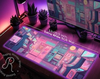 May include: An extra-wide RGB gaming mat, 12 x 35.5 inches, featuring a vibrant arcade game design in pink, purple, and blue hues. The mat has a neon-like border and includes the text "Extra Wide RGB Mat".