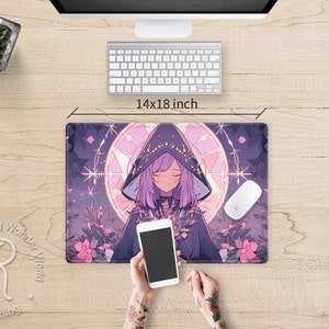 May include: A purple and pink anime-style mouse mat featuring a girl with long purple hair wearing a dark purple hooded cloak. The mouse mat has a circular design with a starburst pattern and a light blue background. The text "Raging Wonder World" is visible in the bottom left corner of the mouse mat.