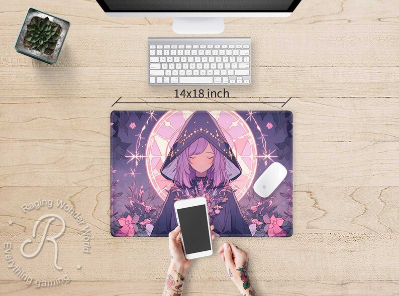 May include: A purple and pink anime-style mouse mat featuring a girl with long purple hair wearing a dark purple hooded cloak. The mouse mat has a circular design with a starburst pattern and a light blue background. The text "Raging Wonder World" is visible in the bottom left corner of the mouse mat.