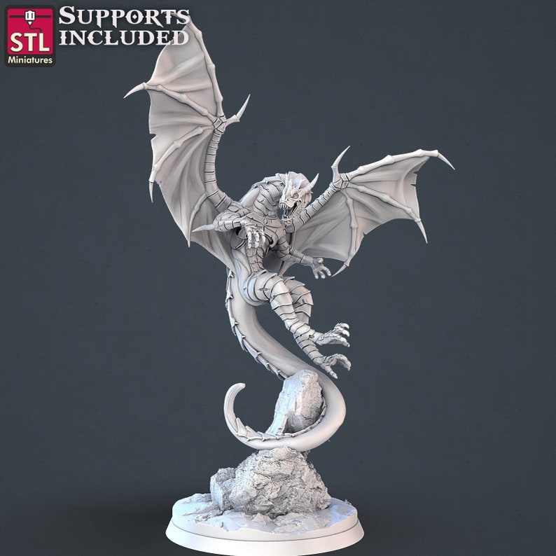May include: A white 3D printed dragon miniature with wings spread, perched on a rock base. The dragon has a detailed, scaly body and a fierce expression.