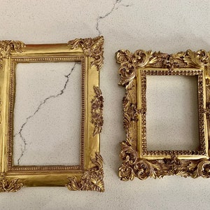 Read description.Frames only. Handmade set of 2 gold ornate resin frames.Photography props styling flat lays wedding part crafts gift decor