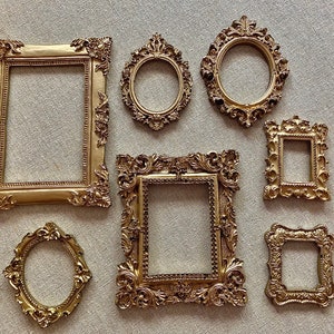 Read description.Frames only. Smaller frames.Handmade antique style resin frames.7 pieces Gold. Photography props flat lay