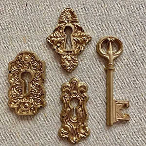 Lock and key set. Resin. Handmade. Antique gold. Ornate. Photography props styling wedding parties crafts decor flat lays