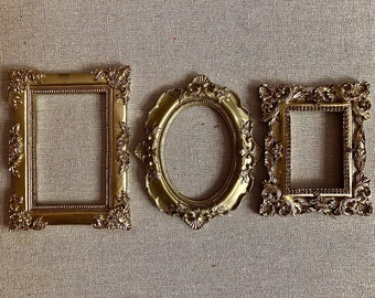 Read description. Smaller frames. Frames only. Set of 3 gold ornate antique style frames. Wedding photography styling flat lays gifts decor
