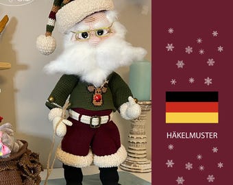 May include: A handmade Santa Claus doll with a white beard, glasses, and a hat with a cream-colored brim. He wears a green sweater, burgundy shorts, and black boots. The doll is holding a rope attached to a small red sled.