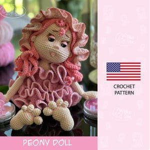 May include: A crocheted doll in a pink dress and hair, with a sweet expression. The doll is seated, with its feet visible. The image includes the text "PEONY DOLL" and "CROCHET PATTERN" next to the American flag. A craft project.
