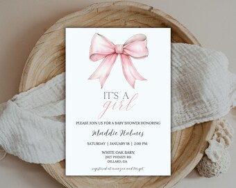 May include: A pink and white baby shower invitation with a watercolor illustration of a pink bow. The text reads "It's a girl" and includes the name "Maddie Holmes", the date and time of the shower, the location, and the registry information.