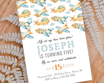 May include: A white invitation card with a blue and yellow airplane pattern. The text reads "My oh my how time flies! Joseph is turning five! Fly on over and celebrate July 15 2:00 PM Riverview Park - 123 Collins Drive - Barton, GA RSVP to Mary at 123.456.7890"