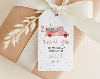May include: A gift tag with a watercolor illustration of a pink ice cream truck, the words "Thank you" and "For making my birthday so sweet" are printed on the tag. The tag is attached to a wrapped gift with a cream ribbon.