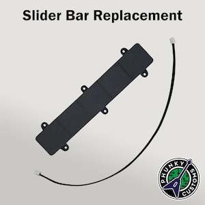 May include: A black slider bar replacement with a connecting wire and a logo that reads "Phunky Customs". The text "Slider Bar Replacement" is at the top of the image. The slider bar has several holes for mounting.