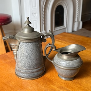 May include: A rustic wooden sign with the text "Welcome to our home" in white lettering. The sign features a distressed finish and a simple, inviting design, perfect for a front porch or entryway.