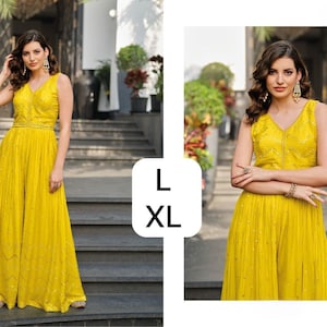 May include: A sleeveless, yellow jumpsuit with a V-neckline and wide legs. The garment is embellished with small, sparkling details. The image also shows the sizes L and XL.