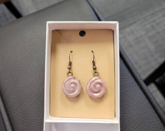 Handmade cinnamon bun earrings.