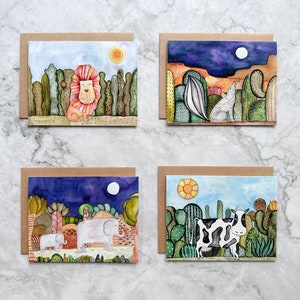 Juego de 4 tarjetas de felicitación de animales, león, coyote, elefantes y tarjetas de vaca.