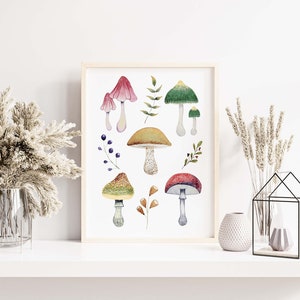 May include: A framed watercolor print featuring various mushrooms in shades of red, green, yellow, and brown. The botanical illustration includes detailed depictions of different mushroom species, leaves, and berries, set against a white background.