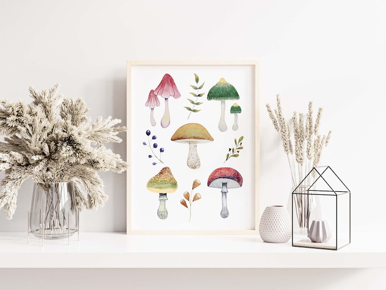 May include: A framed watercolor print featuring various mushrooms in shades of red, green, yellow, and brown. The botanical illustration includes detailed depictions of different mushroom species, leaves, and berries, set against a white background.