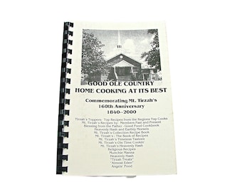 May include: A black and white photo of a church with a sign that reads "Good Ole Country Home Cooking at its Best". The sign also commemorates Mt. Tirzah's 160th Anniversary from 1840-2000. The photo is from a cookbook with a list of recipes from the region's top cooks.