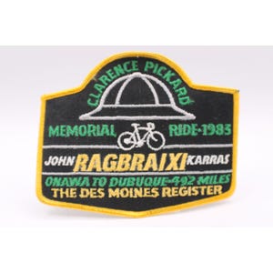 May include: A white ceramic mug with a black handle and the text "But First, Coffee" in a bold, black font. The mug is sitting on a wooden surface.