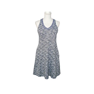 May include: A sleeveless, gray and white patterned dress with a V-neckline.