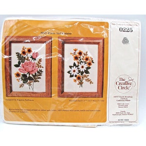 May include: A needlepoint embroidery kit featuring two floral designs, one with roses and the other with daisies. The kit includes cotton/poly fabric, 100% Persian wool yarn, a needle, and instructions. The finished size of each design is 5 inches by 7 inches (12.7 cm by 17.7 cm).