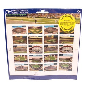 May include: A sheet of self-adhesive postage stamps from the United States Postal Service. The stamps feature illustrations of various baseball stadiums, including Yankee Stadium and Fenway Park. The stamps are labeled "Baseball's Legendary Playing Fields."