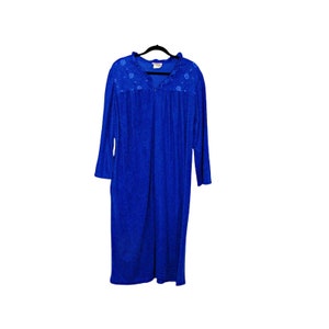 May include: A long blue robe with a white floral pattern on the collar and a zipper closure.