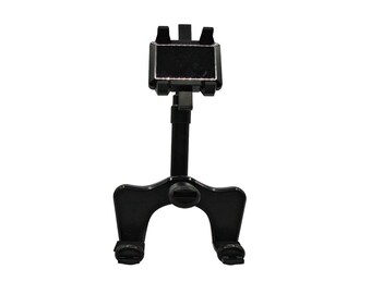 May include: A black, adjustable car phone holder. The holder features a rectangular cradle with four prongs to secure a phone, a telescoping arm, and a base with two feet. The phone holder is designed to mount on a car's dashboard or windshield.