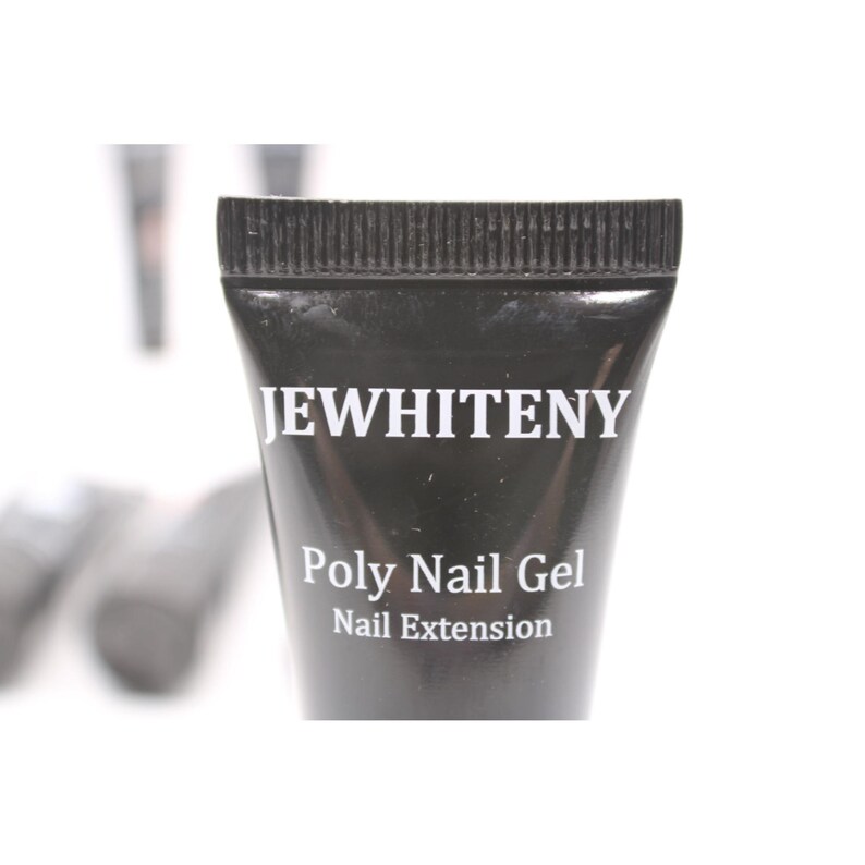 May include: A black tube of "JEWHITENY" Poly Nail Gel for nail extensions. The tube has a ribbed cap and white text. The background is white, with other tubes slightly visible.