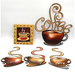 May include: A collection of coffee-themed wall art and decor. Includes a framed picture of a coffee cup, a large brown coffee cup with the word "Coffee" above it, and three coffee cup cutouts labeled "Latte", "Mocha", and "Java".