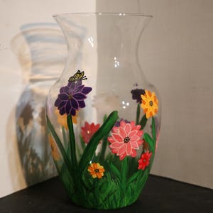 Hand Painted vase with field of flowers and butterfly&#39;s on it.