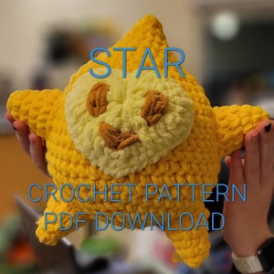 May include: A large, yellow crocheted star-shaped plush toy with a light yellow face and brown accents. The word "STAR" is written across the top in blue, with "CROCHET PATTERN PDF DOWNLOAD" below.