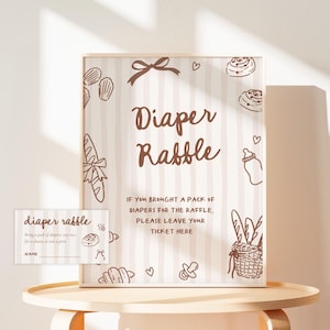 May include: A white ceramic mug with a black handle and the text "But First, Coffee" in a handwritten style. The mug is on a white surface. The mug is likely for hot beverages.